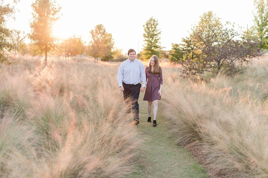 Engaged Couple walking railroad park
