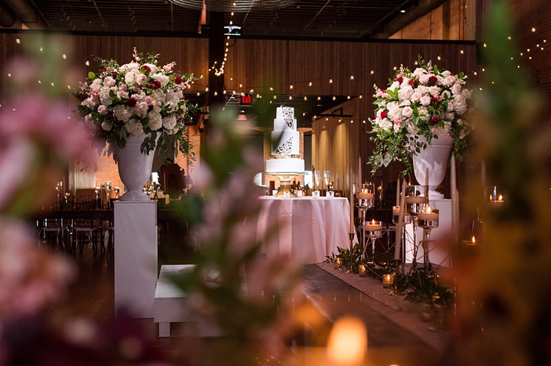 Reception details with cafe lights and gold mirrors at Alley Station Wedding