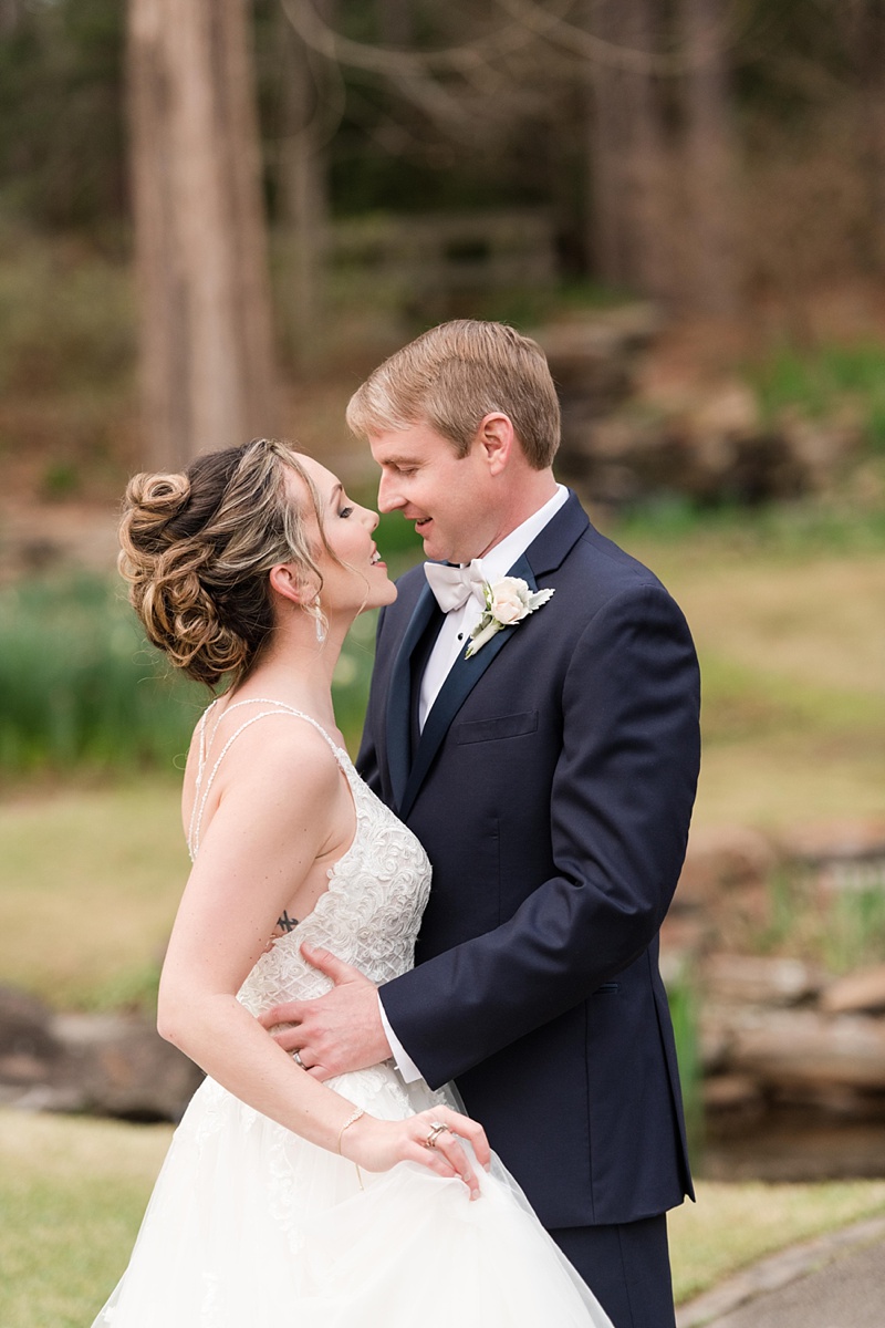 Couples posing for wedding day at garden spring wedding by Meredith Ryncarz