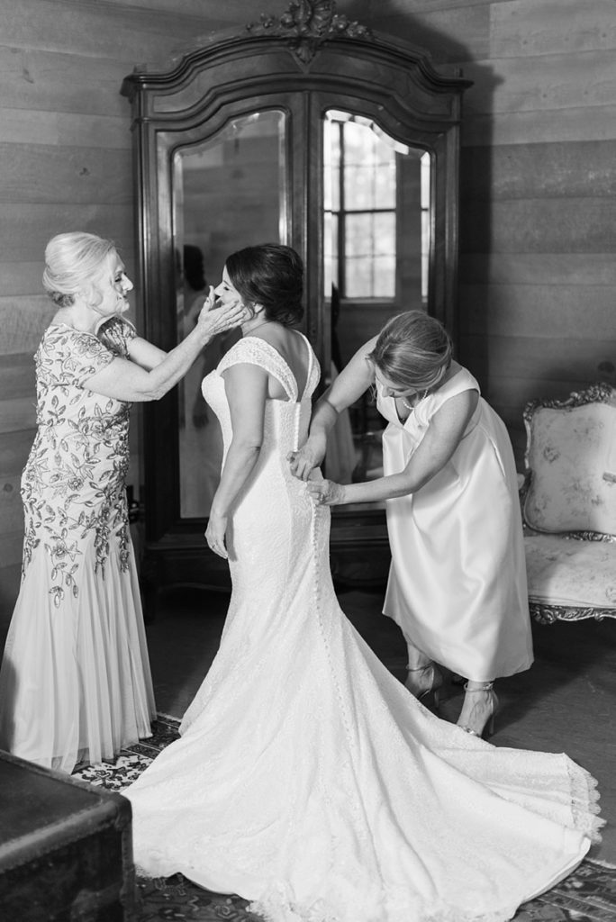 Bride getting ready winter wedding black and white photo