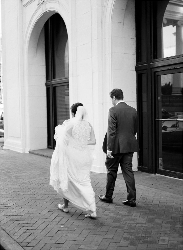 Bride and groom walking to a micro wedding in historic Savannah