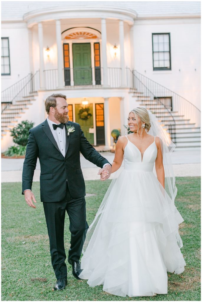 Bride and groom portraits in front of historic estate in Savannah Georgia