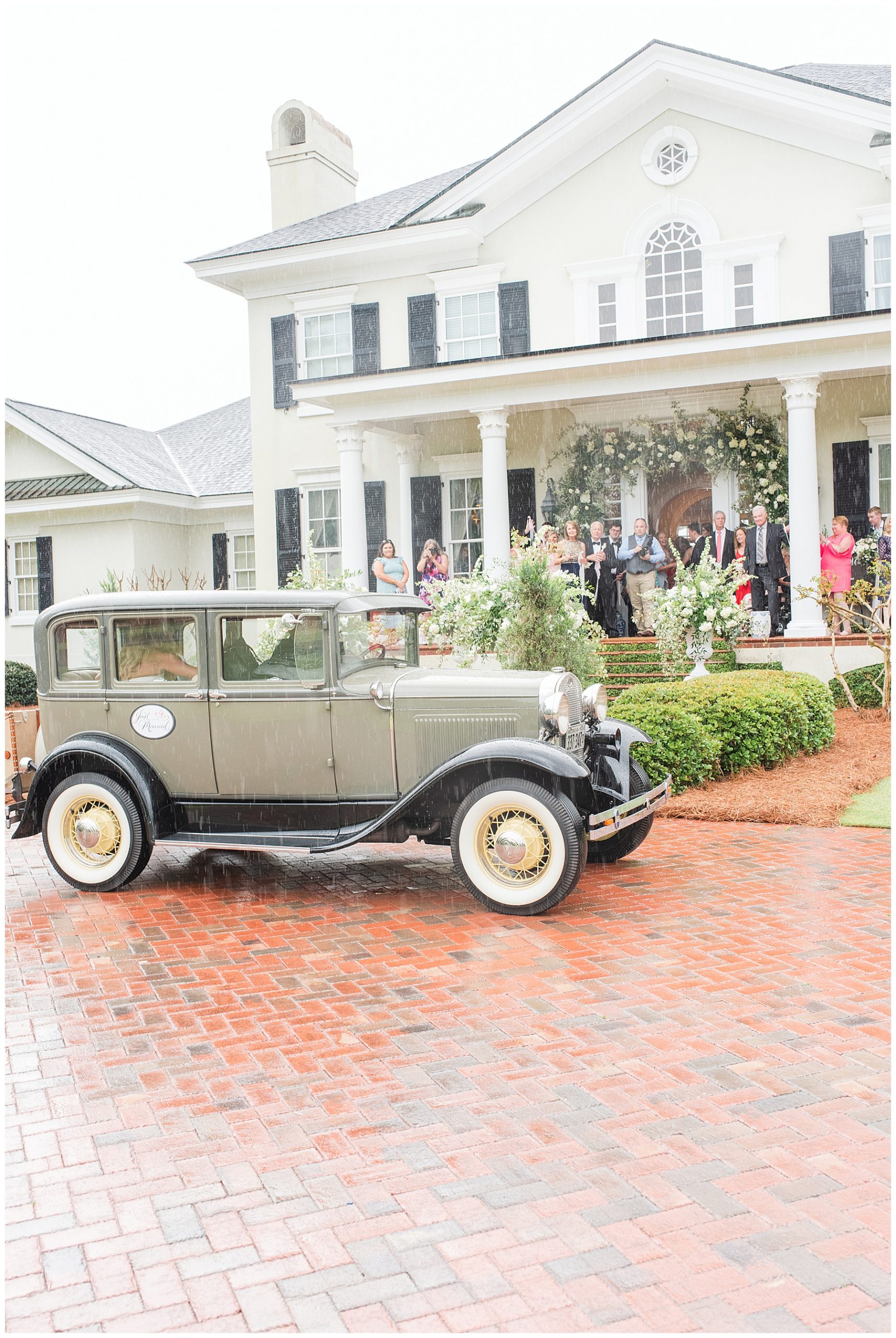 Classic car in the rain at Georgia Estate Wedding