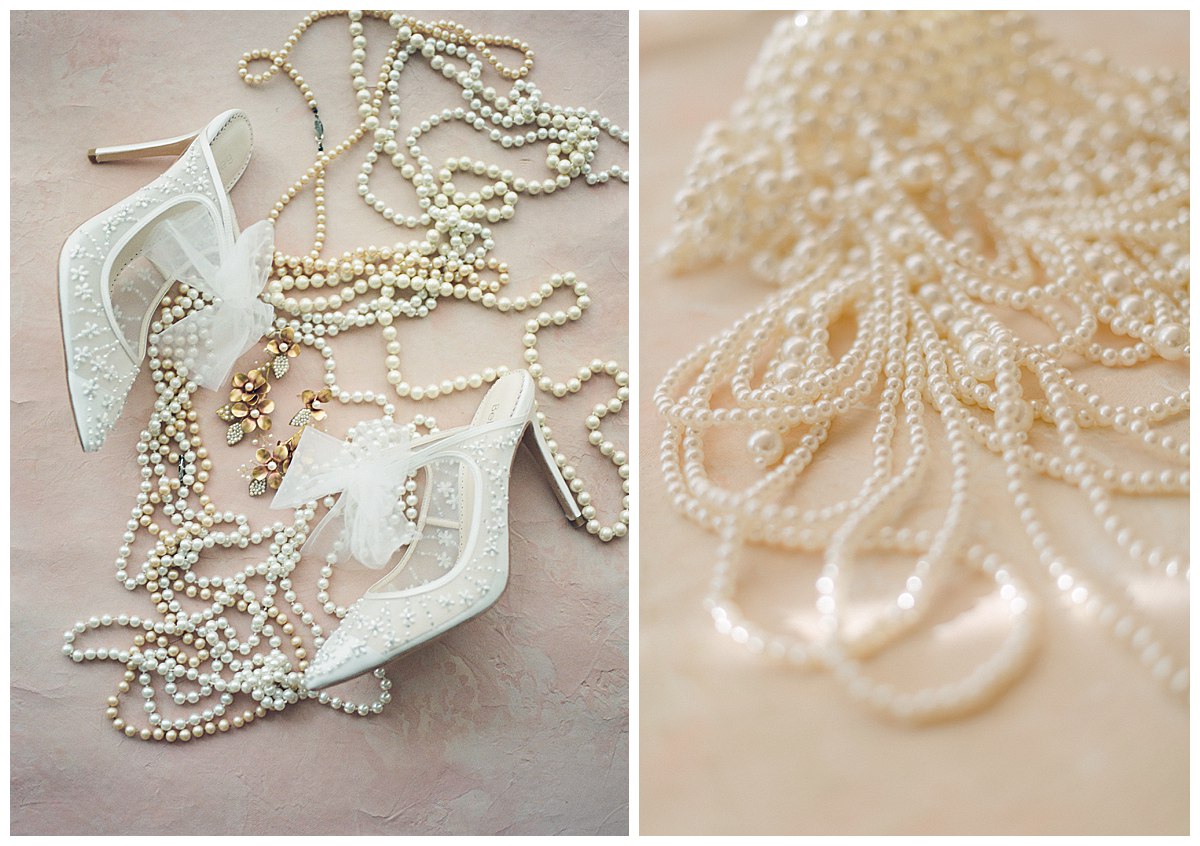 A flat lay of lace high heeled shoes with earrings and pearl necklaces